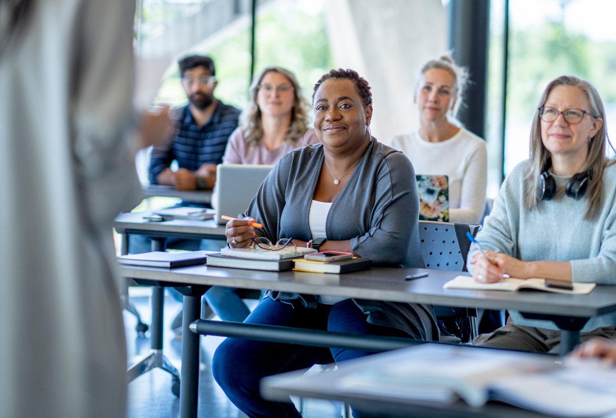 image of educators in a meeting or training session