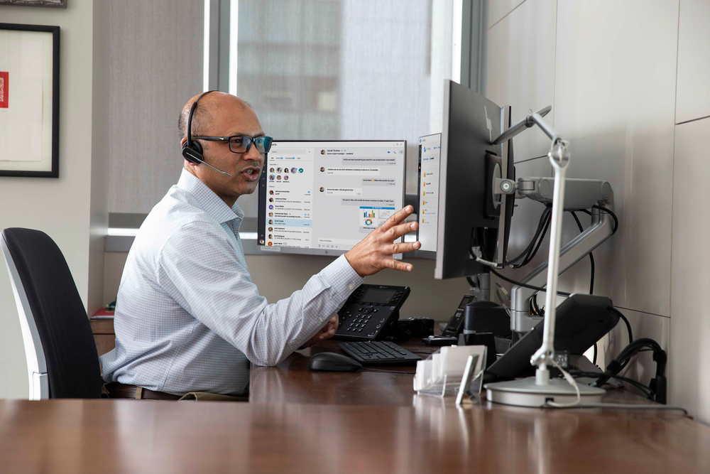 image of an IT professional on the phone with a customer