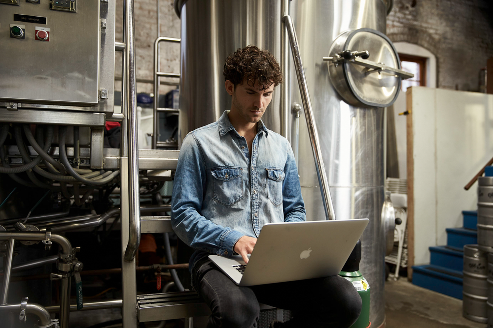 image of a manufacturing employee securely printing from the floor