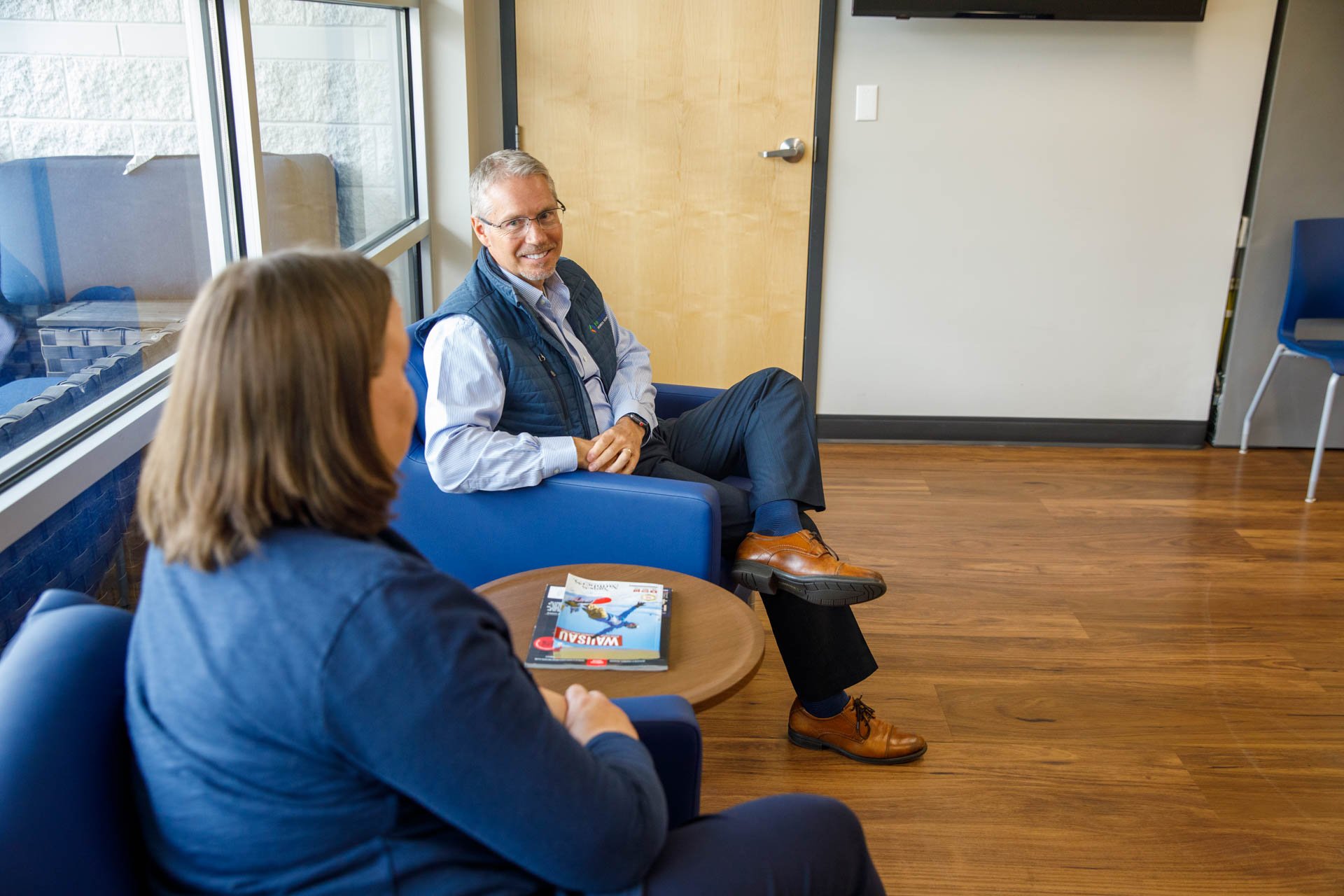 an image of an eo johnson account executive talking to a prospect about business technology