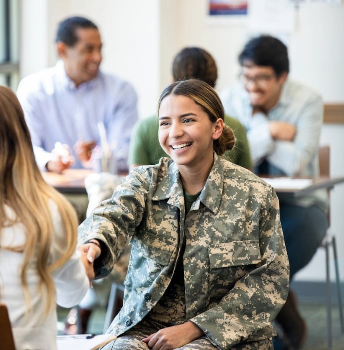 image of a veteran shaking hands with her vso