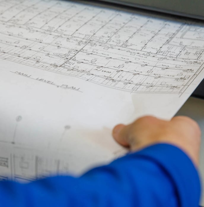 image of wide-format blue prints being scanned by eo johnson